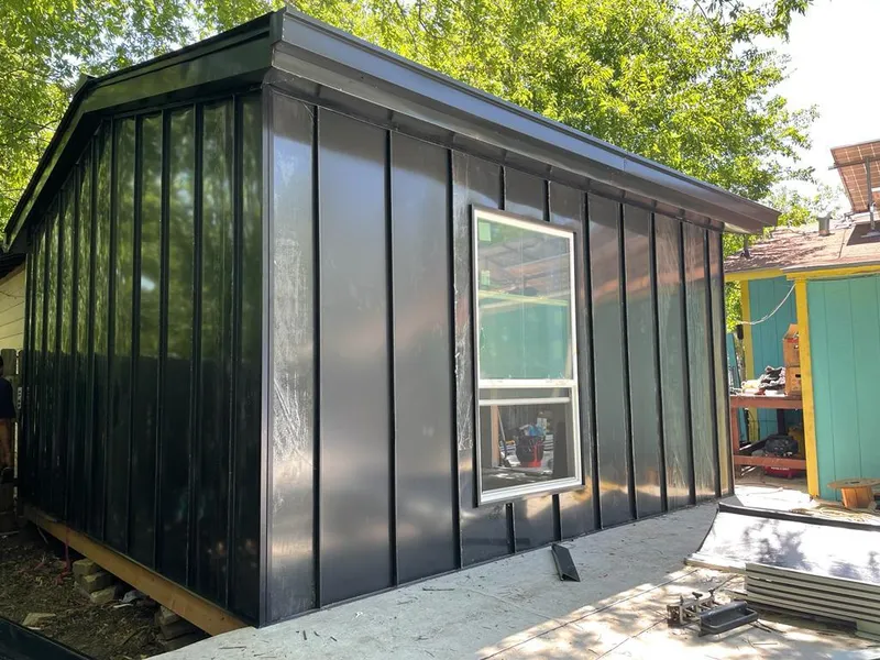 Black standing seam metal wall panels for Roof Inspection in Citrus