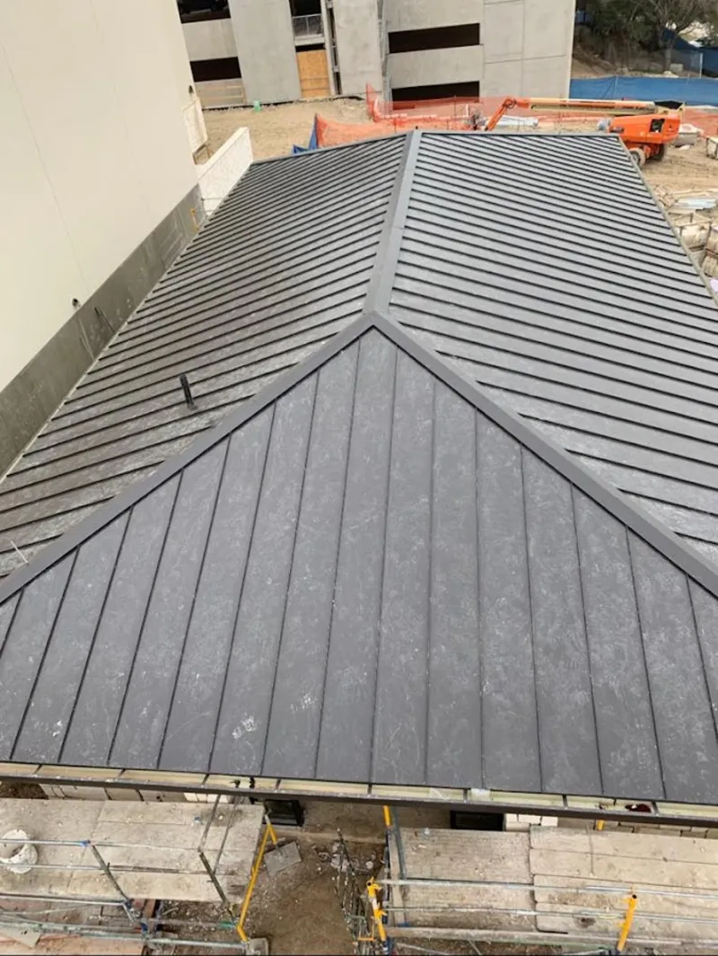 Commercial metal roof construction with crane equipment in Citrus