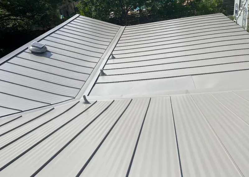 Solar attic fan installed on a metal roof for Roof Ventilation in Citrus